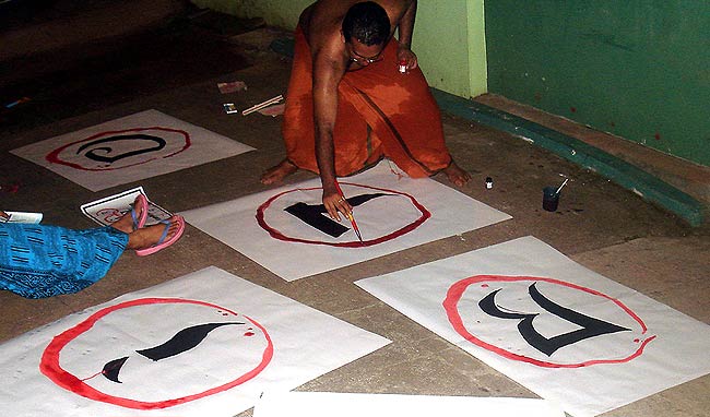Activism Begins at Home: An architect with Design & People prepares protest materials at his residence the previous night. While supporting non-profit organisations and people's movements in India, Design & People also develops its own campaigns mainly on social, political and environment issues.